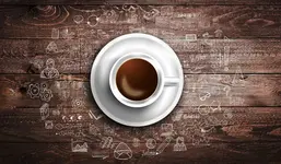 Infograph background template with a coffee cup on real wooden table with infographic design elements and hand drawn sketches of technology items.