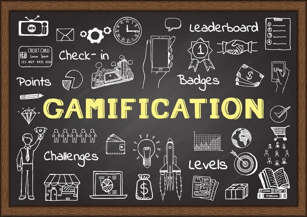 Hand drawn icons about gamification on chalkboard