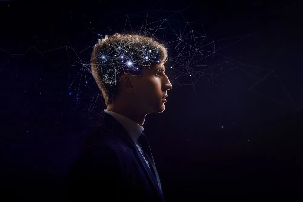 Picture of man with symbol neurons in brain. Thinking like stars, the cosmos inside human brain