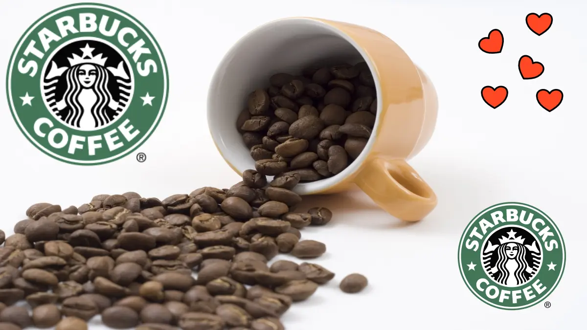 An image of coffee beans poured from a cup onto a table with starbucks logo and a few heart shapes showing love for coffee.