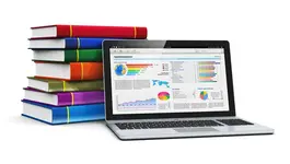 A laptop showcasing vibrant interactive charts against a backdrop of neatly stacked books.