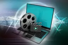 Laptop with reel on blue background