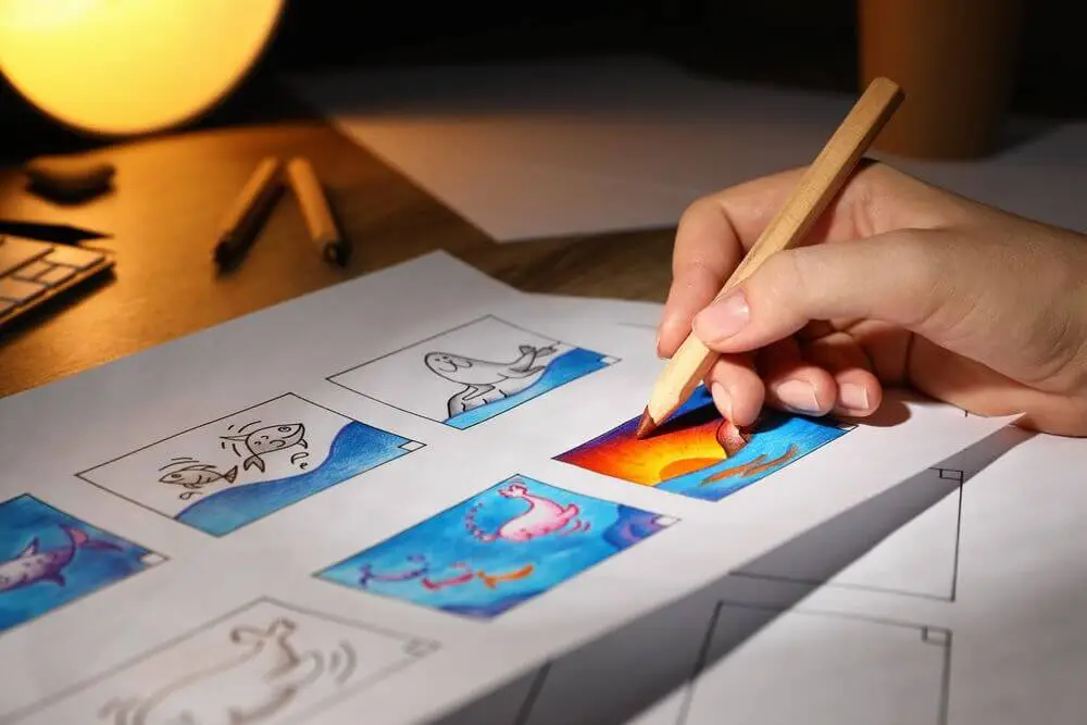 Photo showing woman drawing a storyboard